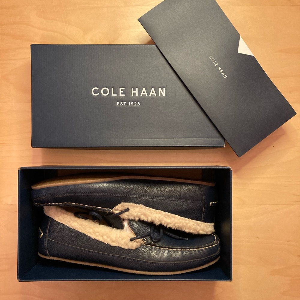 Cole Haan shearling lined slippers.